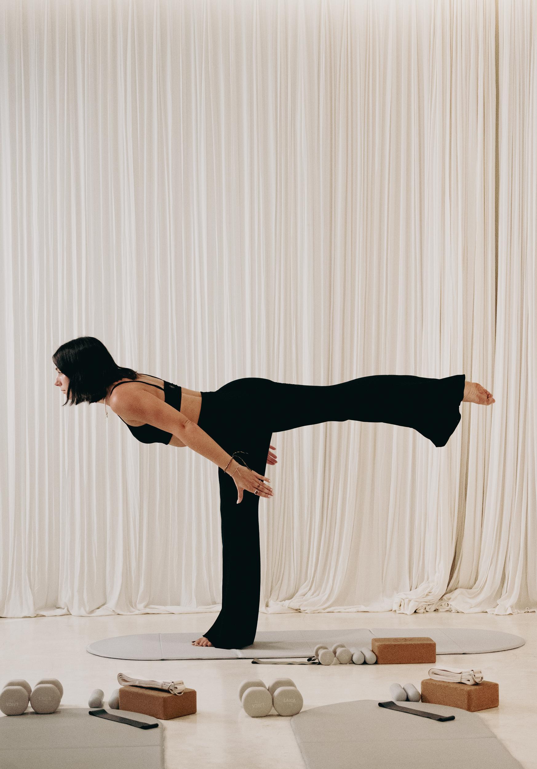 Becks balancing in a standing yoga pose
